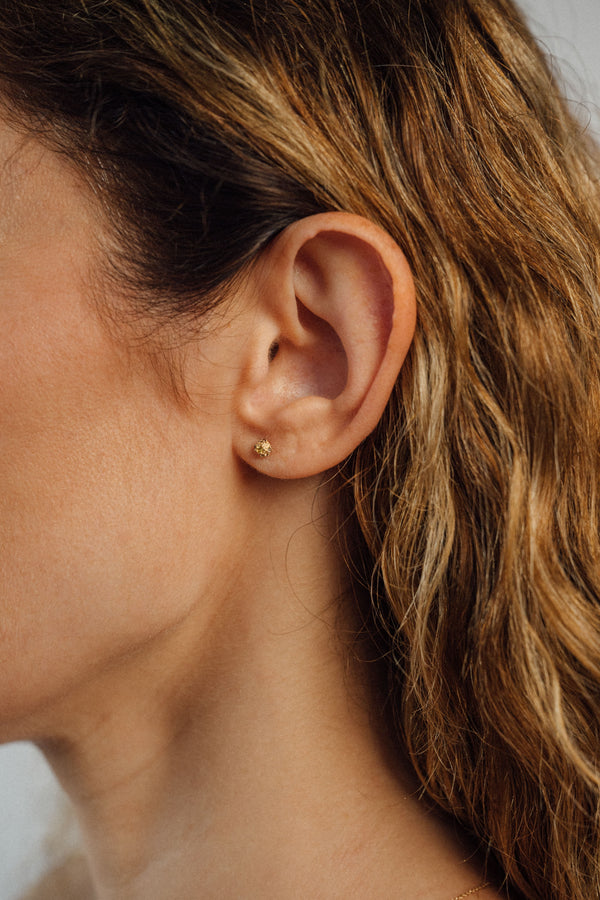 Recycled 18K yellow gold stud earrings, pavé set with brown diamonds and yellow sapphires. Compact, textured design handcrafted in Bali with stones set in Bangkok.